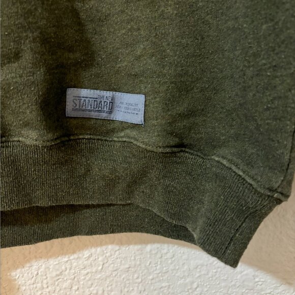 the NEW STANDARD Men's Medium Olive Green crewneck. Lightly worn - Picture 3 of 3